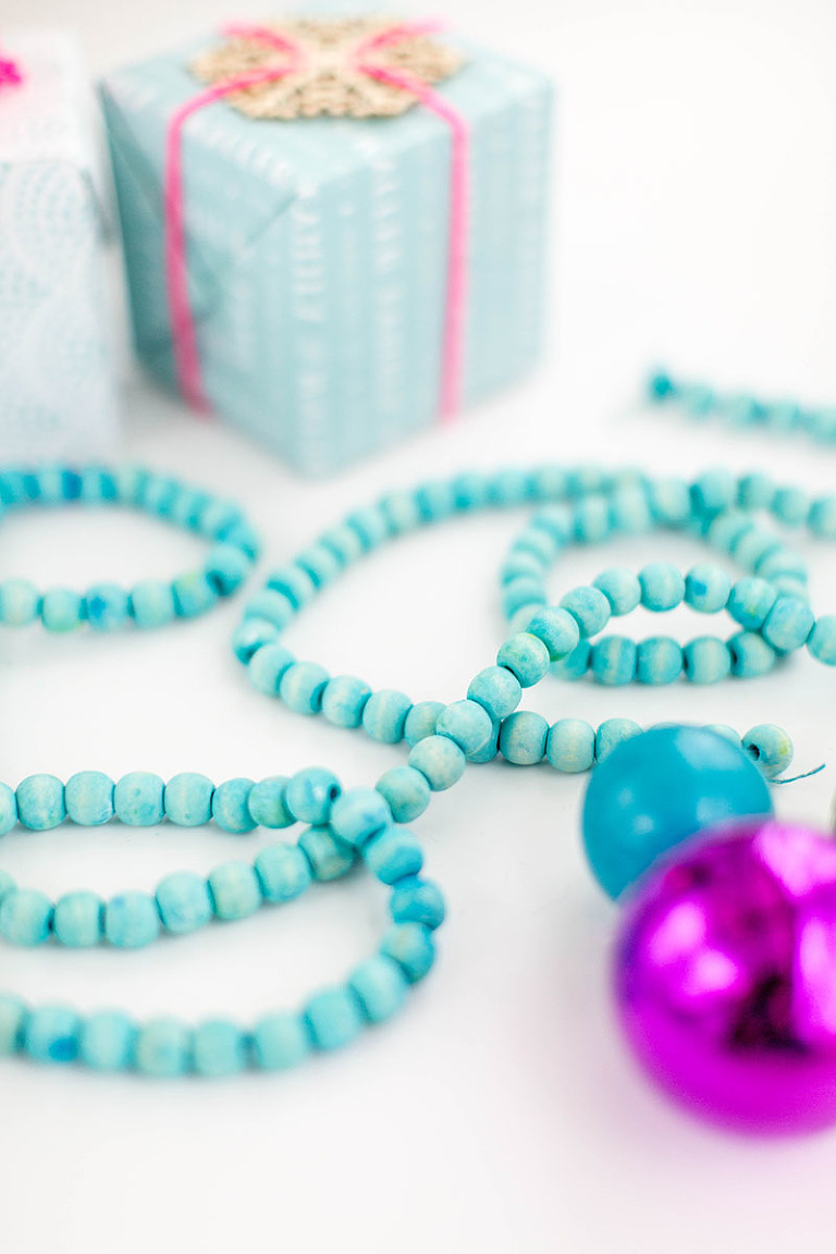 DIY Dyed Wooden Bead Christmas Garland | dreamgreendiy.com + @orientaltrading