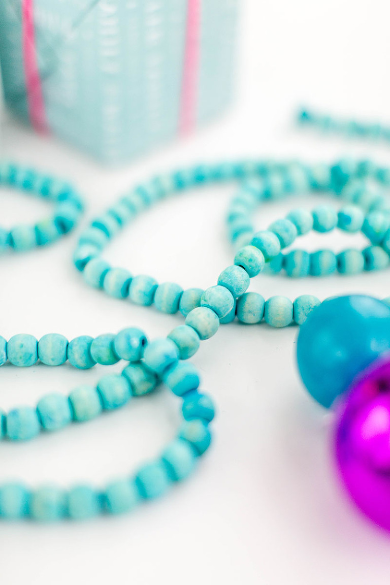 DIY Dyed Wooden Bead Christmas Garland | dreamgreendiy.com + @orientaltrading