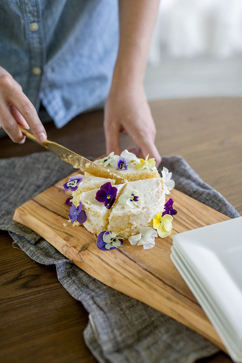 Find out how to turn a clearance grocery store cake into a Pinterest-worthy naked cake with edible flowers.