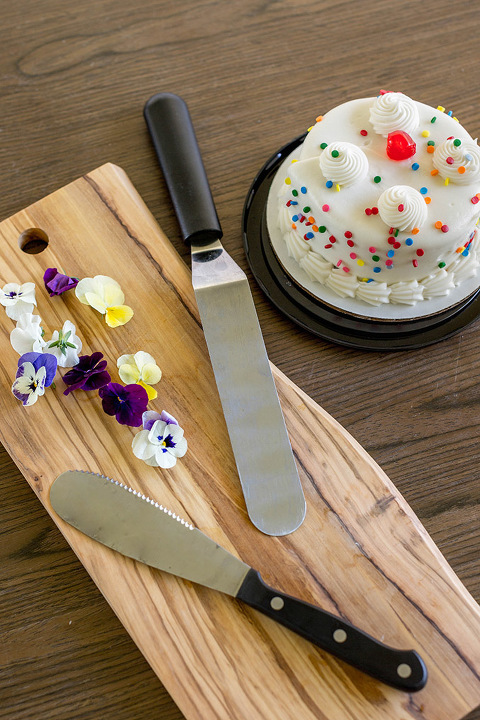 Find out how to turn a clearance grocery store cake into a Pinterest-worthy naked cake with edible flowers.