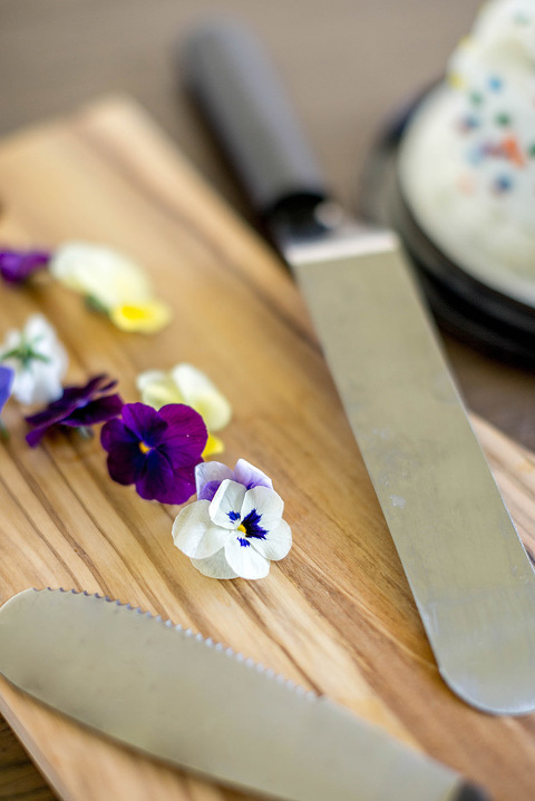 Find out how to turn a clearance grocery store cake into a Pinterest-worthy naked cake with edible flowers.